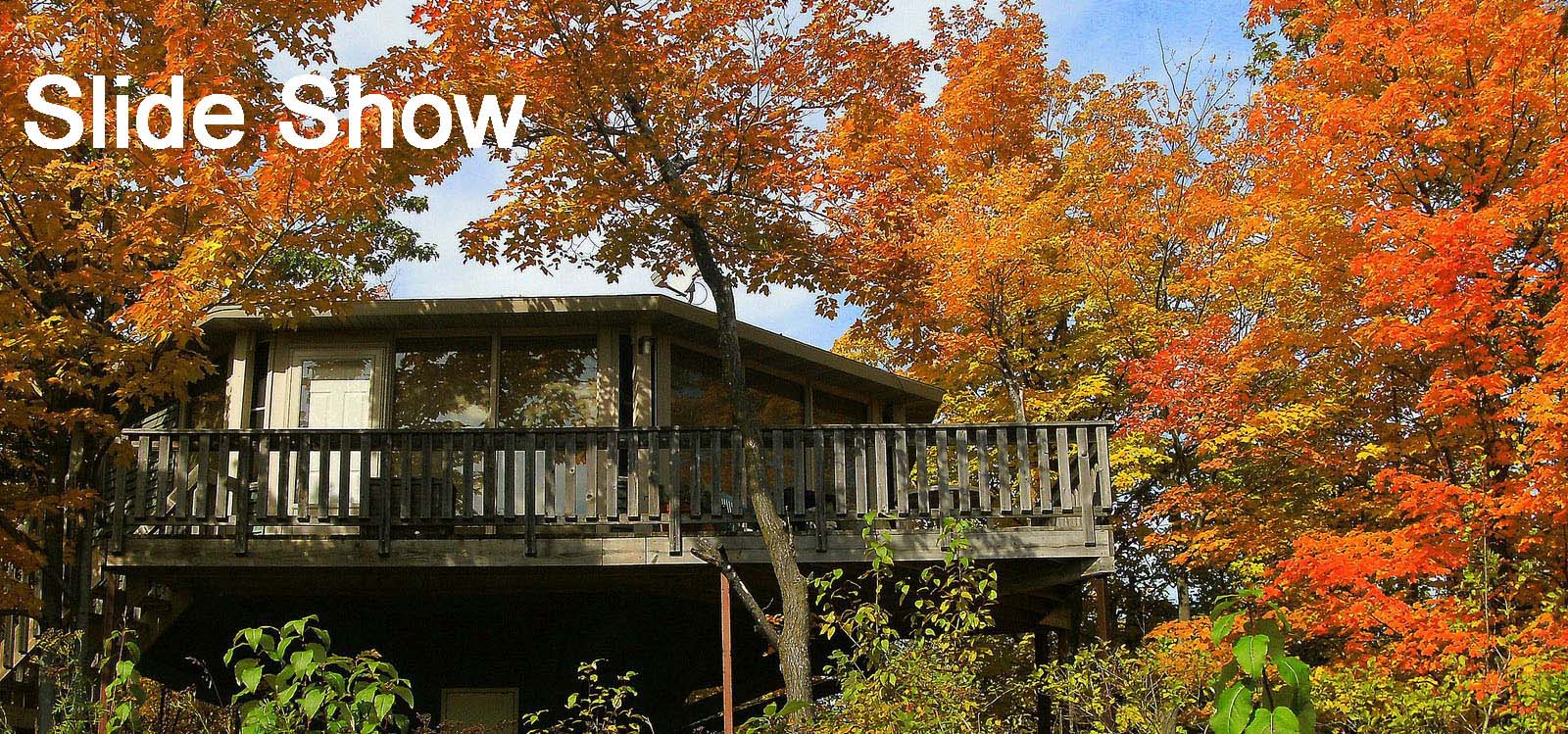 A view of a Mountain Villa surrounded by beautiful autumn leaves. It is a link to a Slide Show