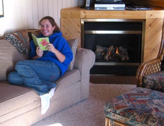 Photo of a guest reading a guest comment book