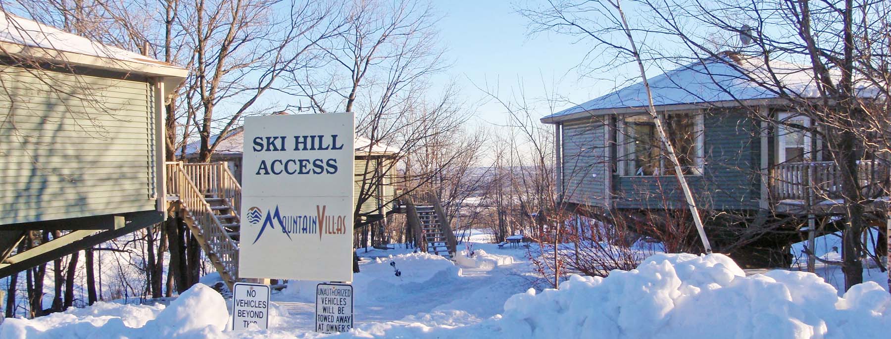 A view of several Mountain Villas near a trail to the Spirit Mountain ski hills