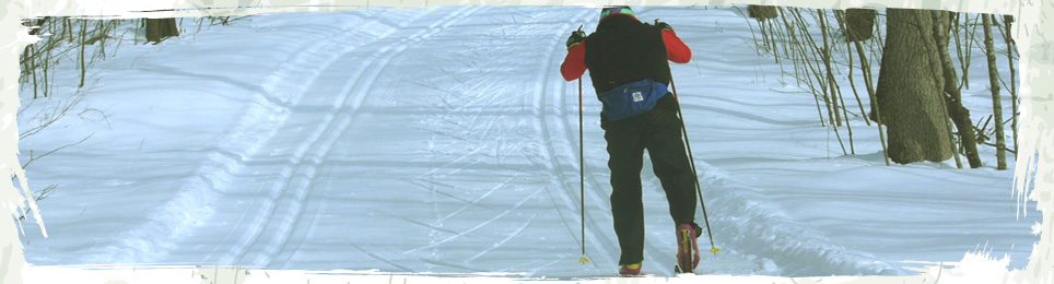 A view of a skier on the Cross Country ski Trail, located within 200 feet of the Mountain Villas office